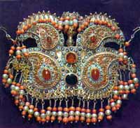 Temporal and ear pendant. The 19th century. Silver, turquoise, coral, glass.  Stamping, filigree, gilding.